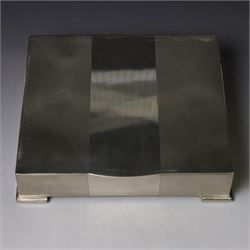 1960s silver mounted cigarette box, of rectangular form with engine turned decoration, upon four bracket feet, with presentation engraving to interior lid reading  'British Aircraft Corporation (Operating) Limited Commemorating the Queen's Award to Industry 1967, hallmarked James Geraghty, Birmingham 1965, with retailers mark for Asprey, W16.5cm, H4.5cm, in Garrard & Co Jewellers box