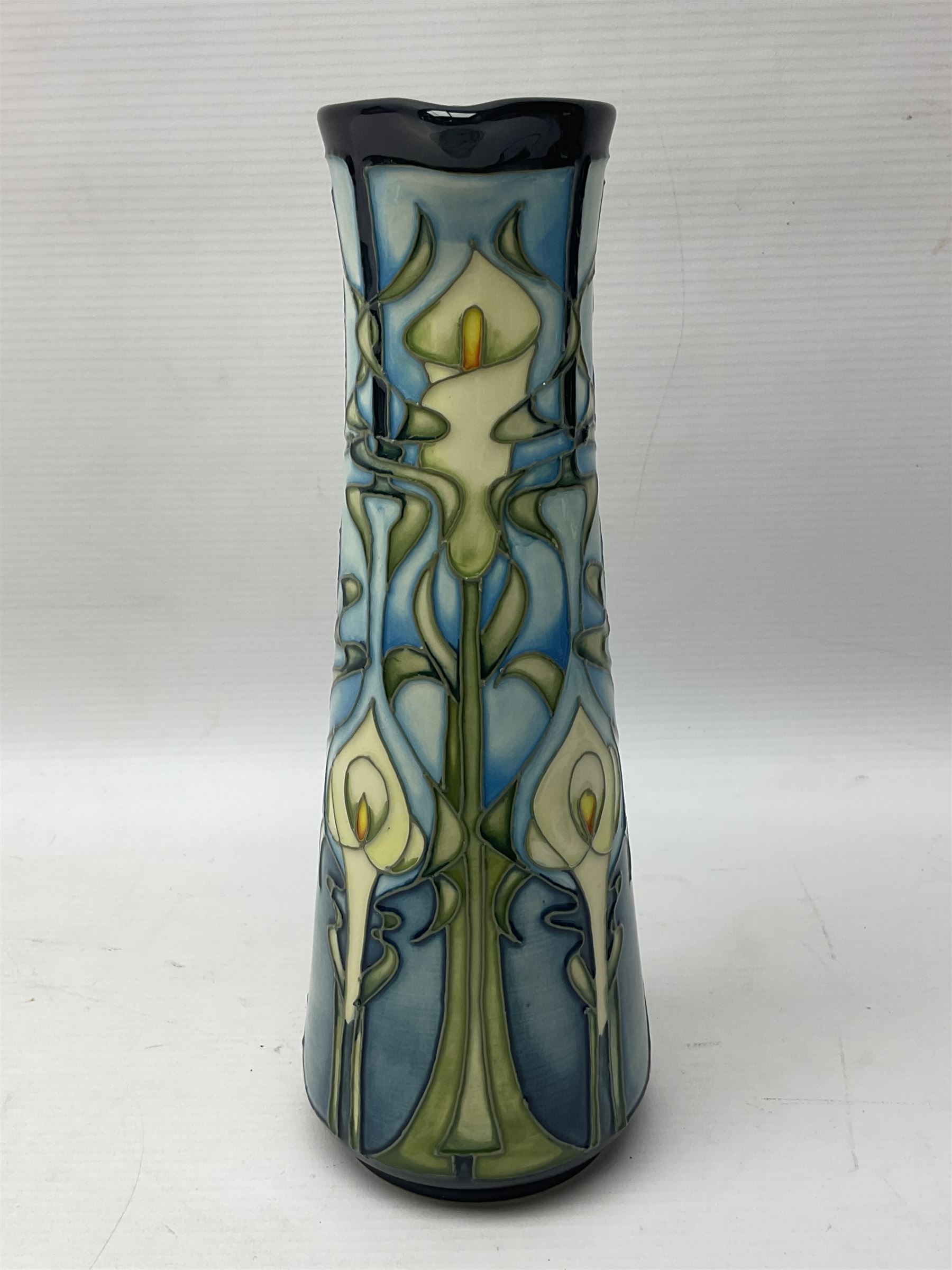 Moorcroft jug, of tapering form, decorated in the Calla Lily pattern by Emma Bossons, circa 2001, H24cm