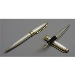  Writing Instruments - Montblanc Meisterstuck set of two fountain pen with '18k' gold nib and ballpoint pen, both full sterling silver cases, both boxed with warranty/service guide (2)   