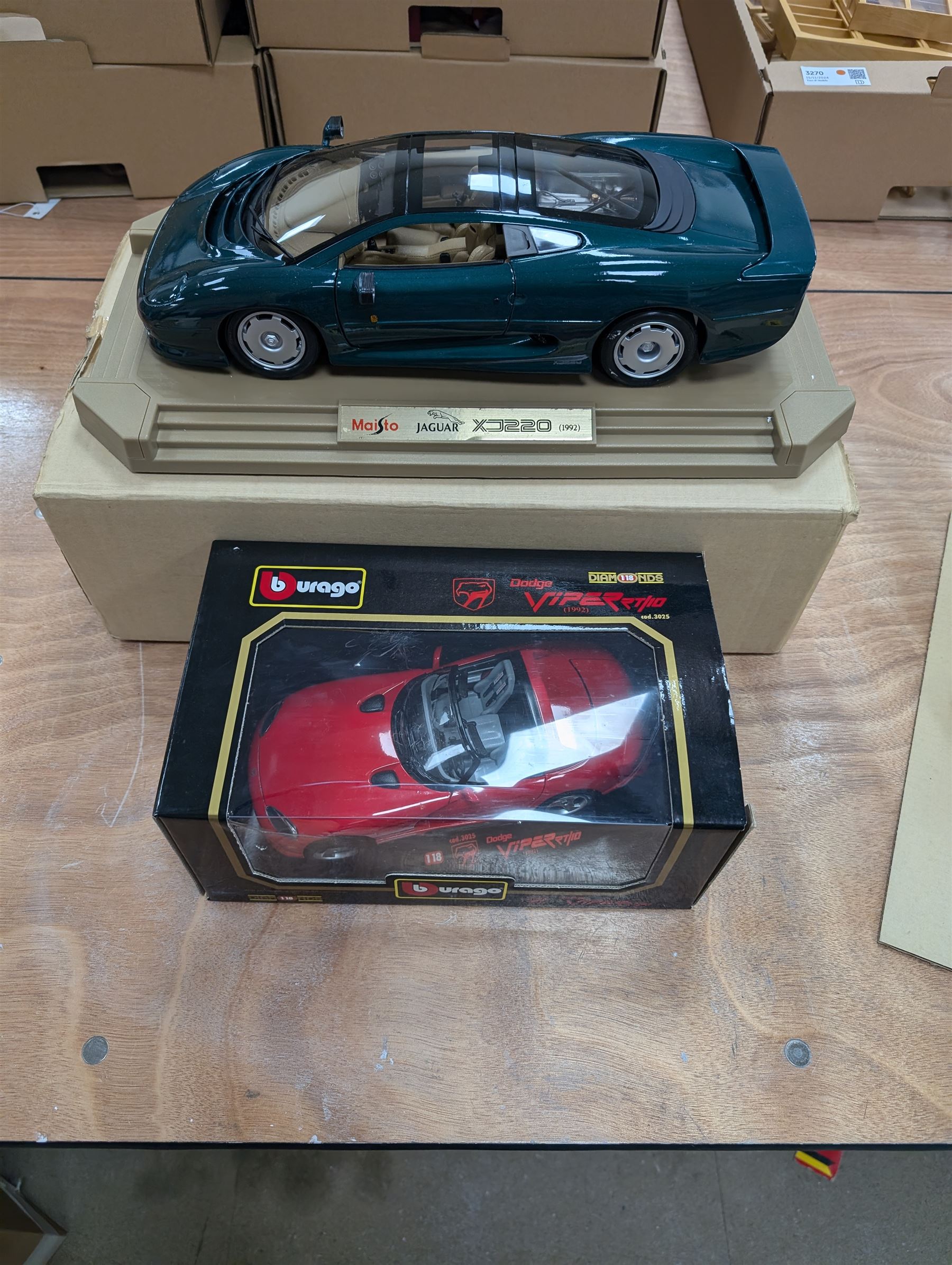 Two diecast cars, comprising Maisto 1:12 scale 1992 Jaguar XJ220 and a Burago 1:18 scale 1992 Dodge Viper RT10, both boxed