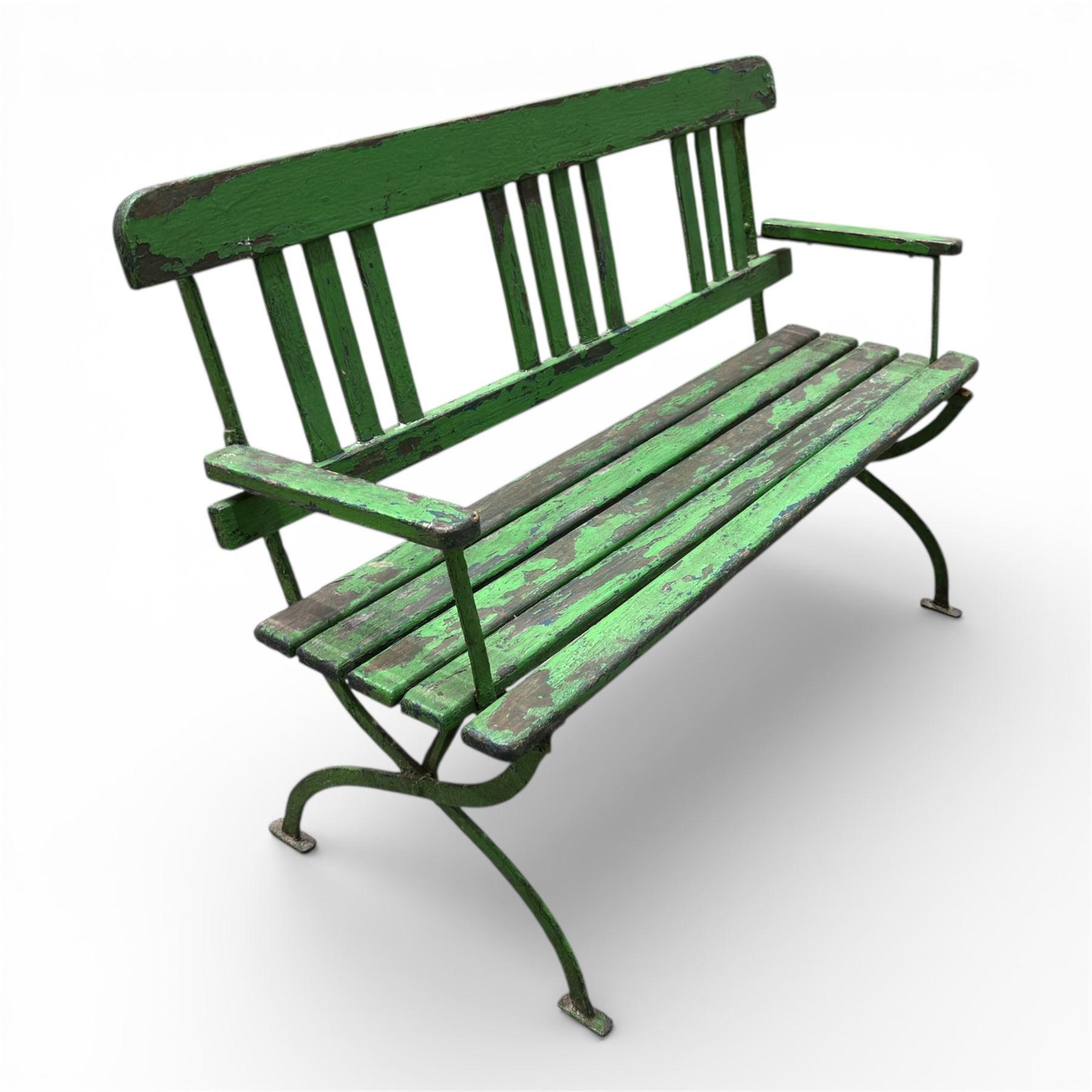 Early 19th century child's garden bench, the wrought iron frame with X frame legs and wooden slatted seat, painted in green, H63cm L90cm D35cm