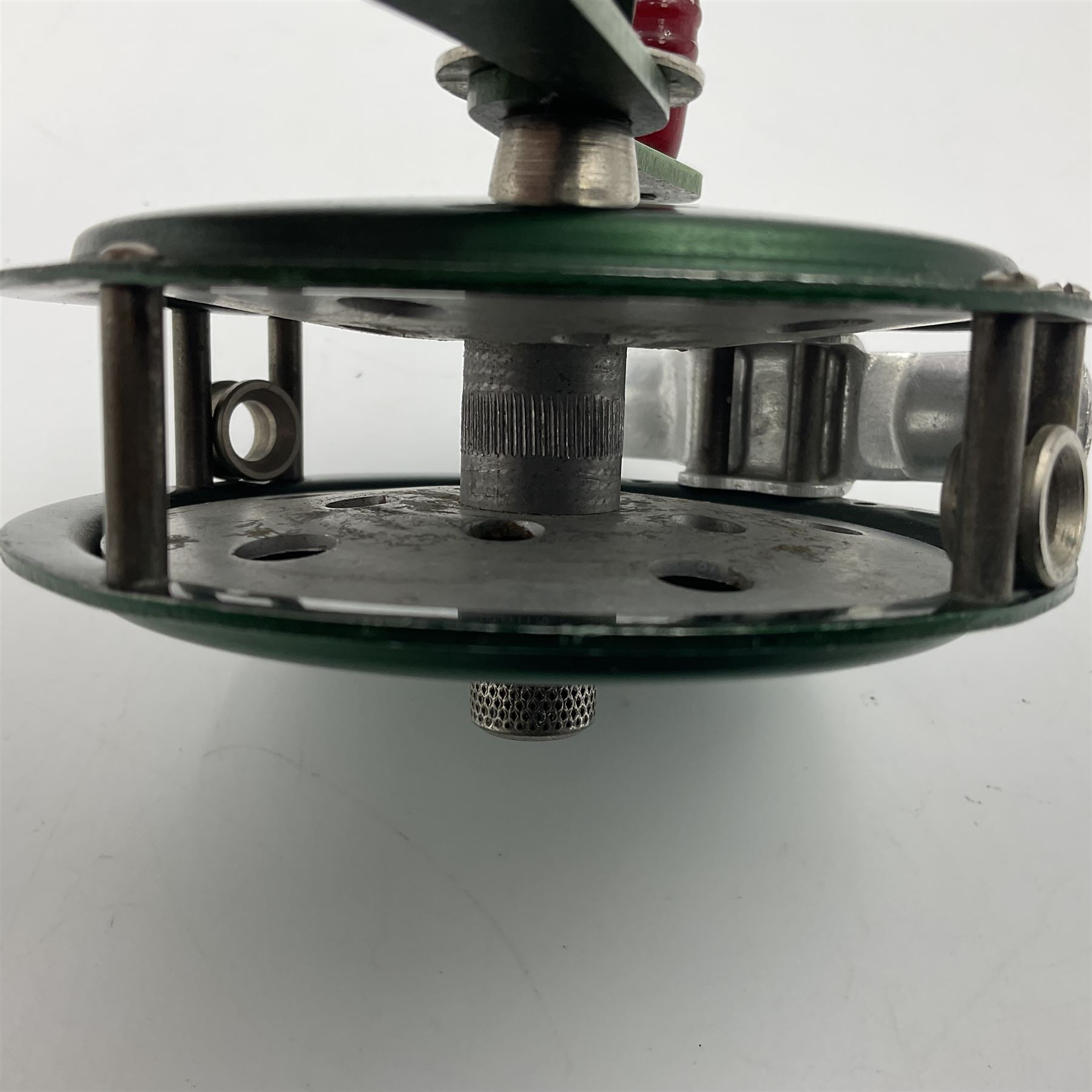 TO RTV Three fishing reels, including American Pflueger progress bulldog size 60 brass and chrome skeleton fly reel, with wooden handle; Maginot 106 fly reel and an alloy reel (3)