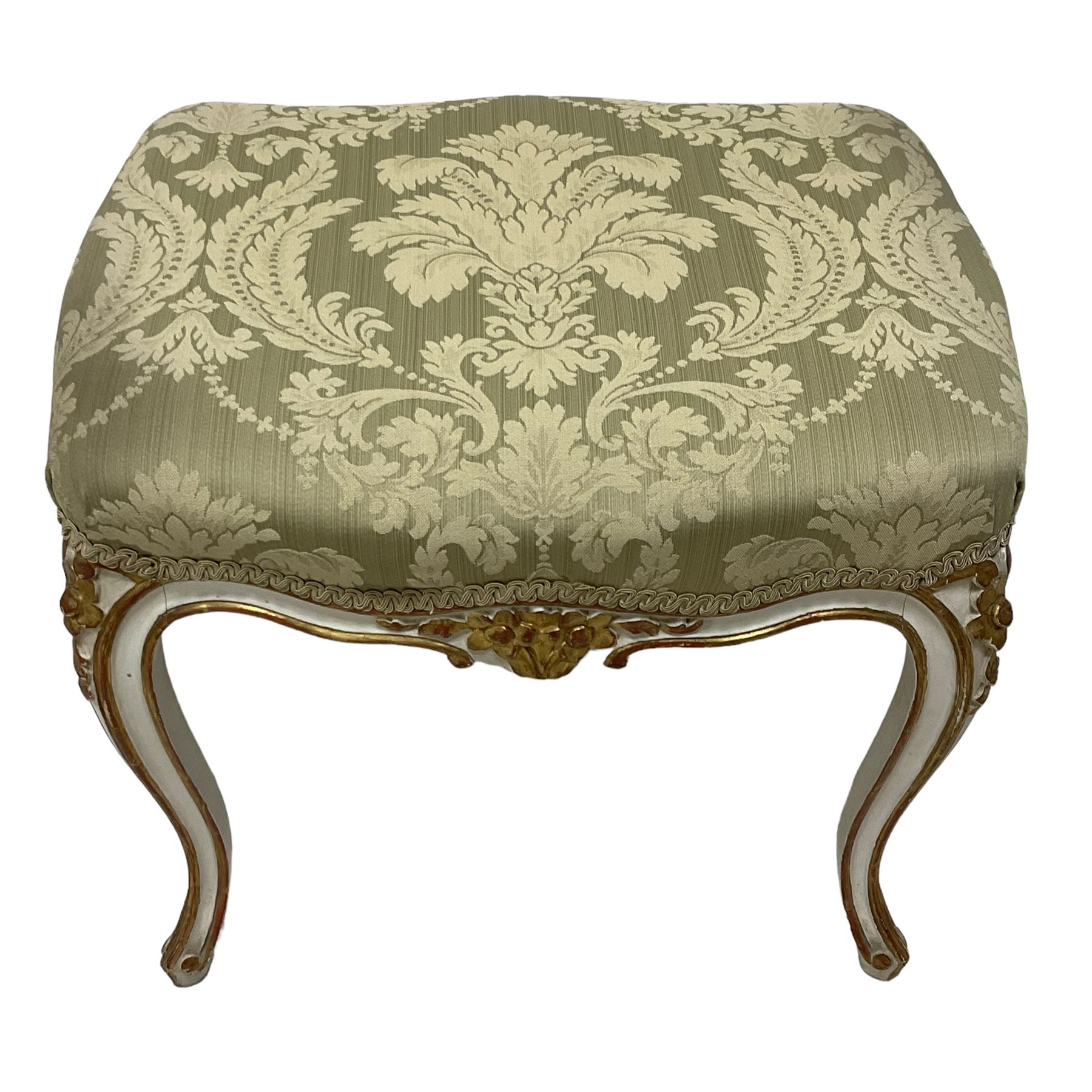 20th century French design parcel gilt and painted dressing table stool, upholstered in sage green damask fabric, shaped form on floral carved cabriole supports, with matching cushion 