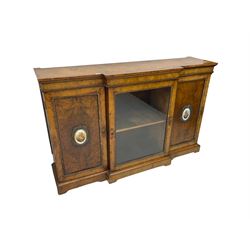 Victorian figured walnut break-front credenza, central glazed door flanked by two panelled doors with Sevres style portrait oval panels, ormolu foliate beading and moulded cartouche escutcheons, on plinth base