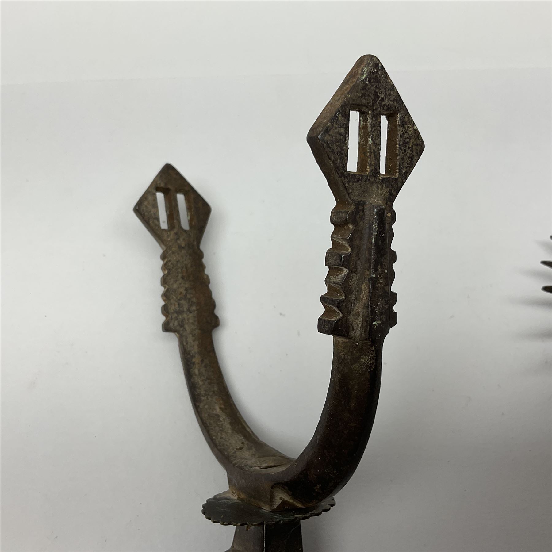 Pair of South American gaucho steel and brass spurs with twenty-two spike heel rowels, possibly Chilean L23cm