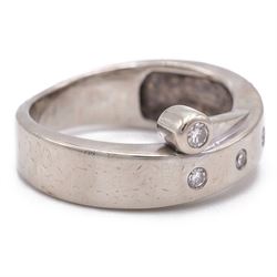 14ct white gold four stone diamond crossover ring, rubover and bezel set with four round cut diamonds, stamped 585