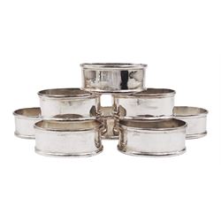 Set of eight modern silver napkin rings, of plain oval form, hallmarked with import marks for Birmingham