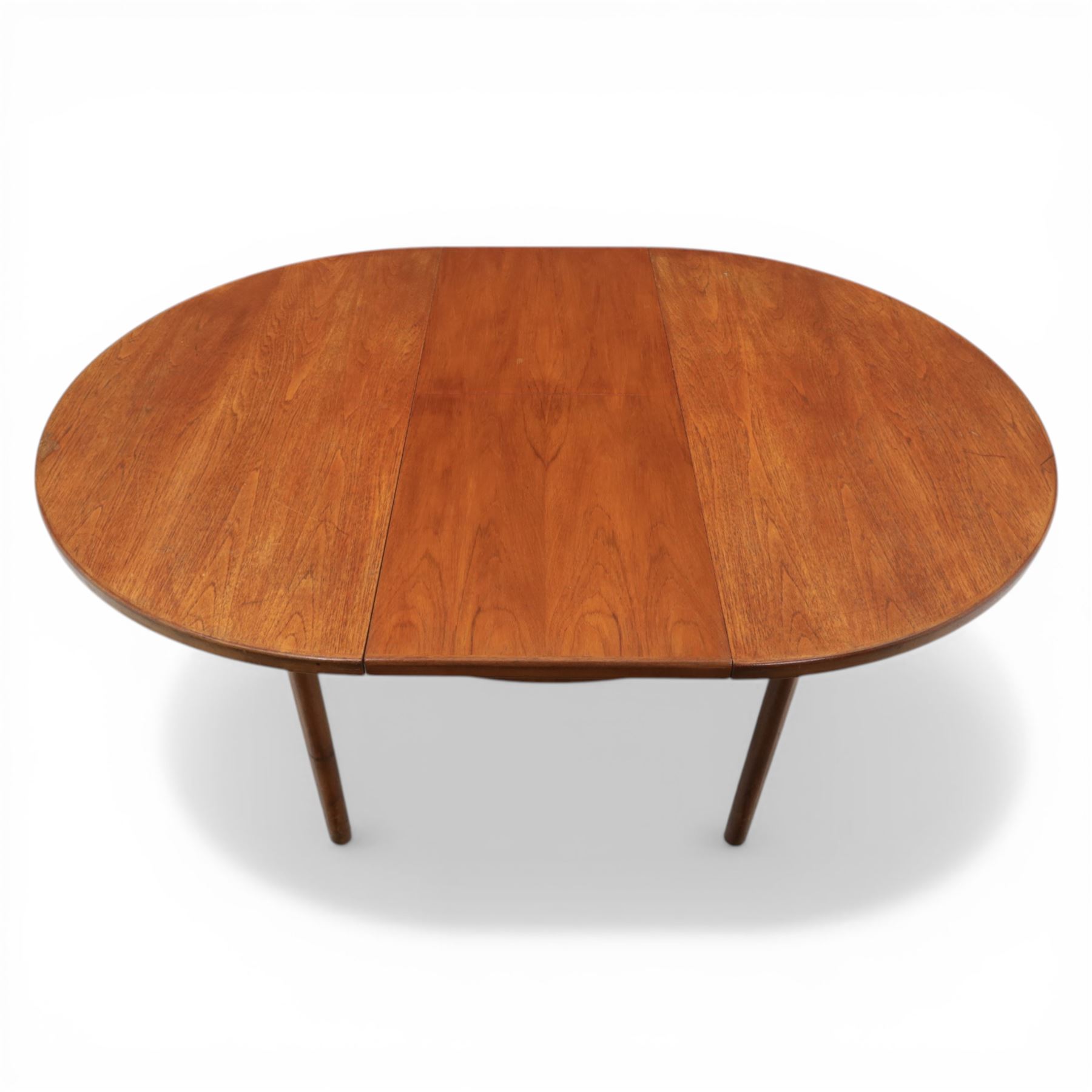 A H McIntosh & Co of Kirkcaldy - teak circular top with moulded edge enclosing butterfly leaf extension, raised on four tapering supports, extending action revealing central leaf, 167cm fully extended
