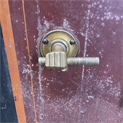 Samuel Withers & Co of West Bromwich - Victorian cast iron safe, the brass handle modelled as a clenched fist, painted in red, orange and black, with key. Ground floor delivery only, no steps.