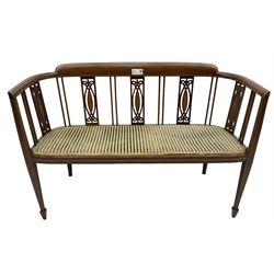 Edwardian inlaid mahogany two-seat salon sofa, curved back and arms inlaid with boxwood stringing, vertical slat back with pierced splats inlaid with satinwood, upholstered seat, on square tapering front supports with spade feet 