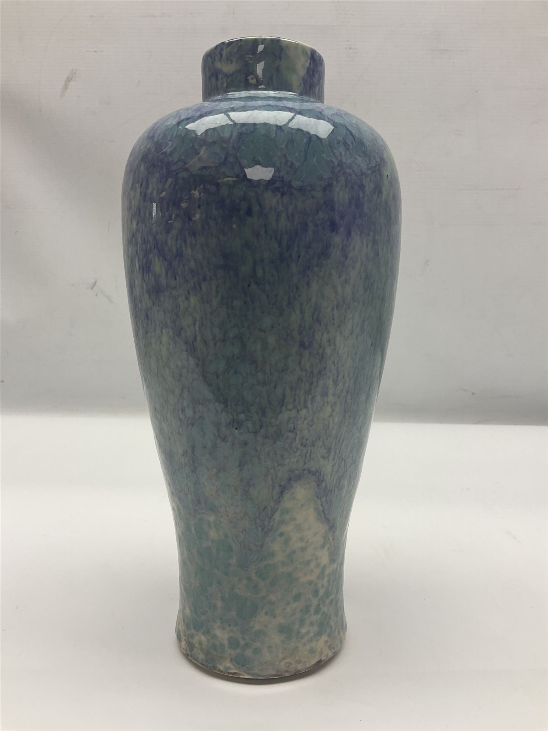 Holyrood Pottery vase of bulbous form decorated in a mottled and streaked green and blue glaze, with printed mark beneath, H24cm