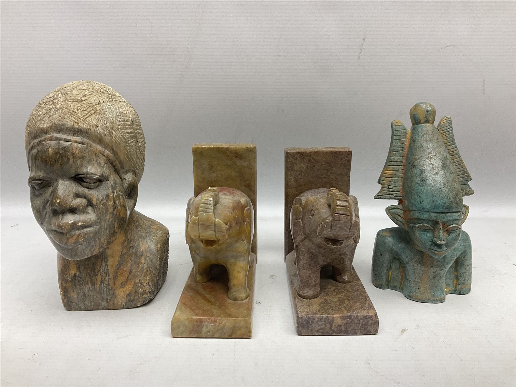 Pair of soapstone figural bookends carved with elephants, African soapstone bust, Buddha bust, Egyptian style etc, tallest H18cm