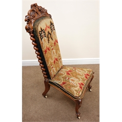  Victorian walnut framed needlework chair, shaped carved foliate cresting rail, upholstered back and seat flanked by barley twist columns, cabriole legs on castors, W53cm  