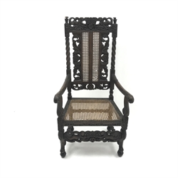  Carolean style oak chair, heavily carved back depicting mermaids, cane work splat and seat, W62cm  