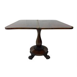 Victorian mahogany tea table, rectangular top with rounded corners, folding and swivelling to reveal interior surface, supported on a faceted baluster-shaped column, raised on a circular platform base with carved acanthus details, ending in four lion paw feet