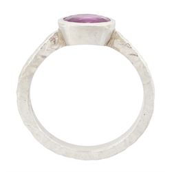 Platinum pink sapphire ring, single bezel set sapphire of approx 1.40 carat, to a planished shank, London 2019