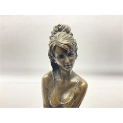 Art Deco style bronze modelled as a female figure seating crossed legged upon a chair, after Pierre Collinet, H28cm