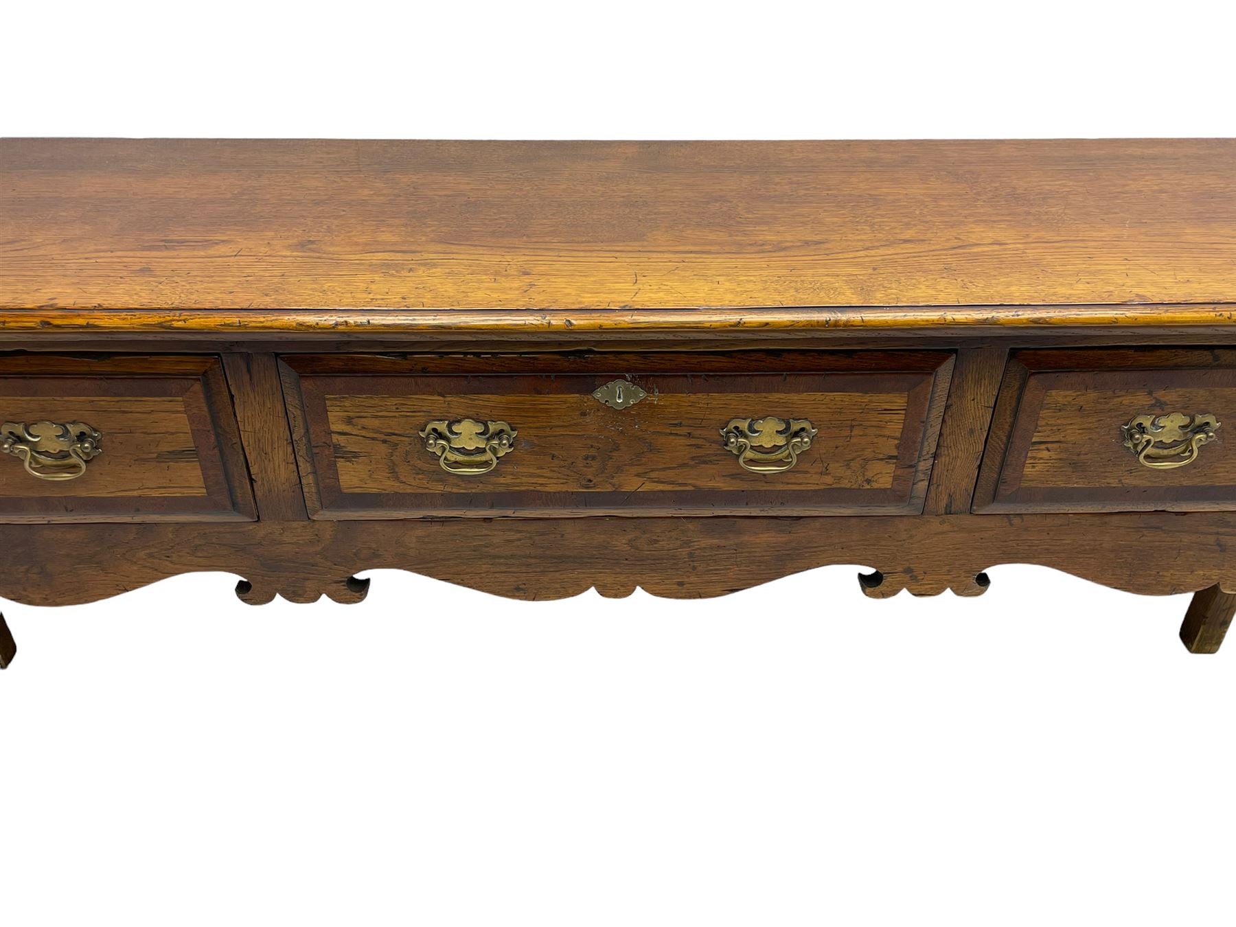 Georgian design oak dresser base, moulded rectangular top over three drawers with moulded fronts and mahogany bandings, shaped apron on cabriole front supports