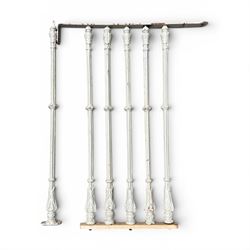 Victorian design cast iron spiral staircase, sixteen pierced treads, ornate balustrades, with landing and handrail painted in cream finish, height of pole 250cm, width of steps 74cm