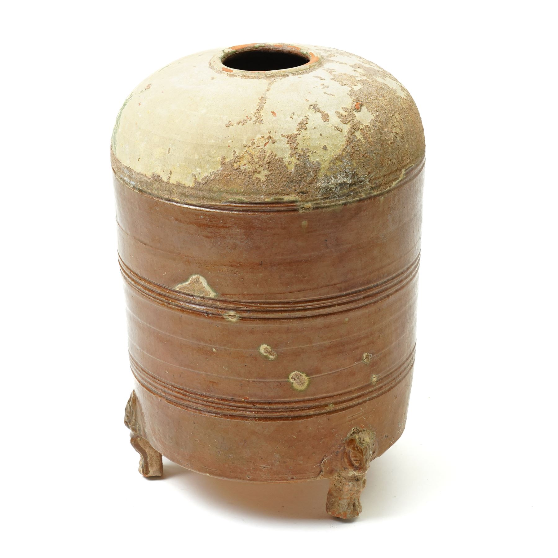 Chinese Han dynasty (202BC-9AD) brown glazed grain store, of cylindrical form, the feet formed as lions,  H26cm