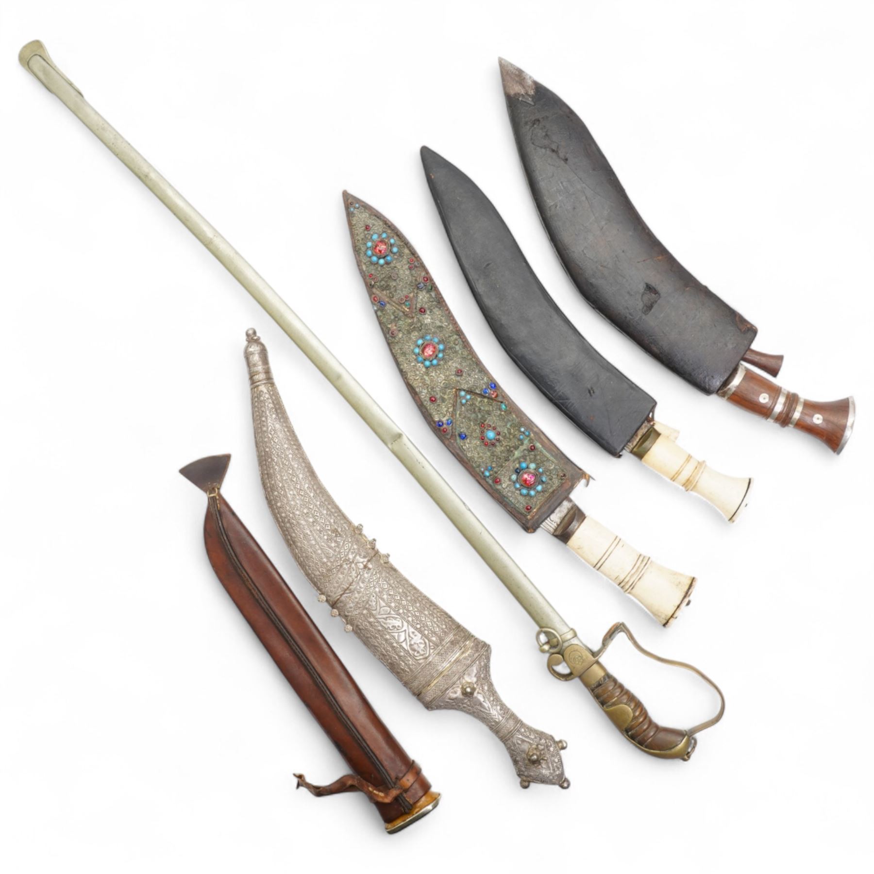 Gurkha Kukri with horn handle and jewelled scabbard, two other Kukris, Arab jambiya Finnish sporting knife with birch handle by Martiini Rovaniemi and German made WWI sword probably for the Turkish market