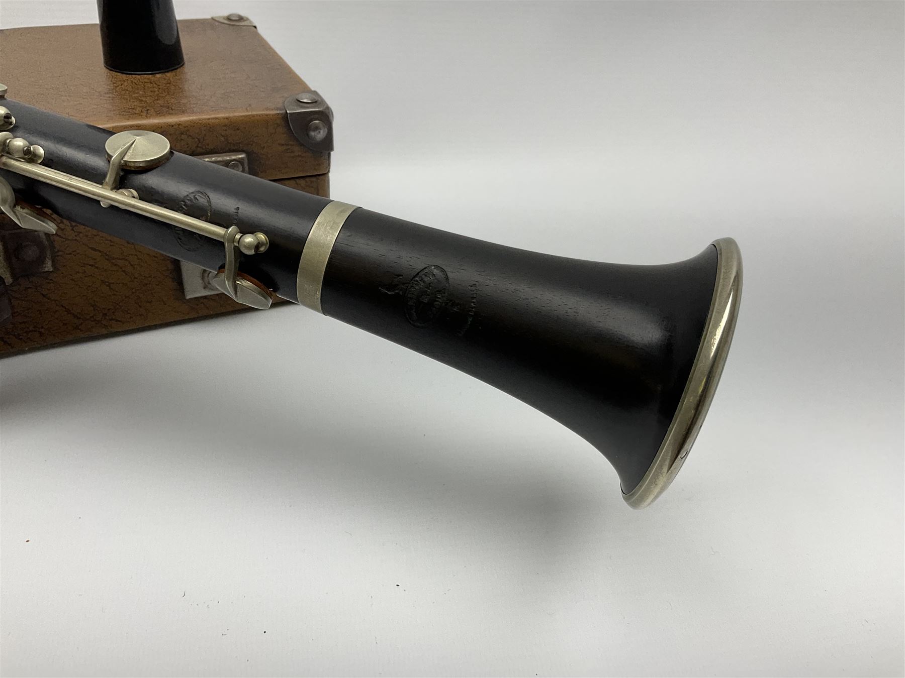 Buffet Crampon Paris African blackwood four-piece clarinet with nickel fittings, impressed 'BCPB 1937', multiple stamps for 'Macdonough & Son Sole Agent London' L67cm; in rexine covered case with two unused reeds. Biographical information: The Macdonagh family have links with the Royal Philharmonic Orchestra and are also reputedly linked with Thomas Macdonagh who was involved in the 1916 Irish uprising.