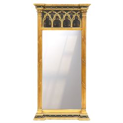Tall Gothic Revival ebonised and gilt pier mirror, the projecting cornice with foliate orn...