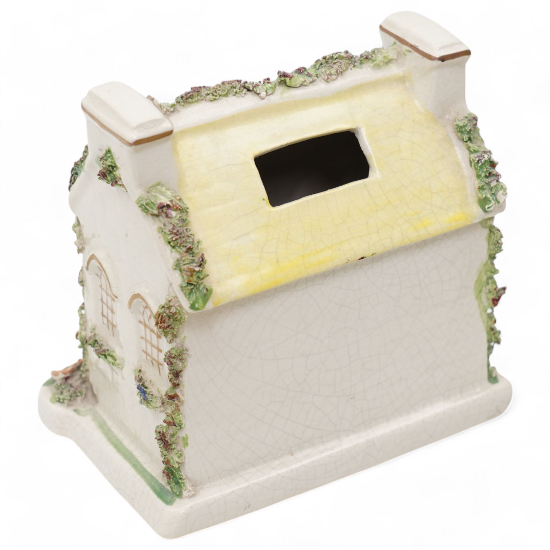 19th century pottery money box in the form of a two storey house with applied floral decoration W14cm  and six pottery cottage pastille burners