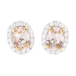 Pair of 18ct white and rose gold morganite and diamond earrings, each stud set with a sing...
