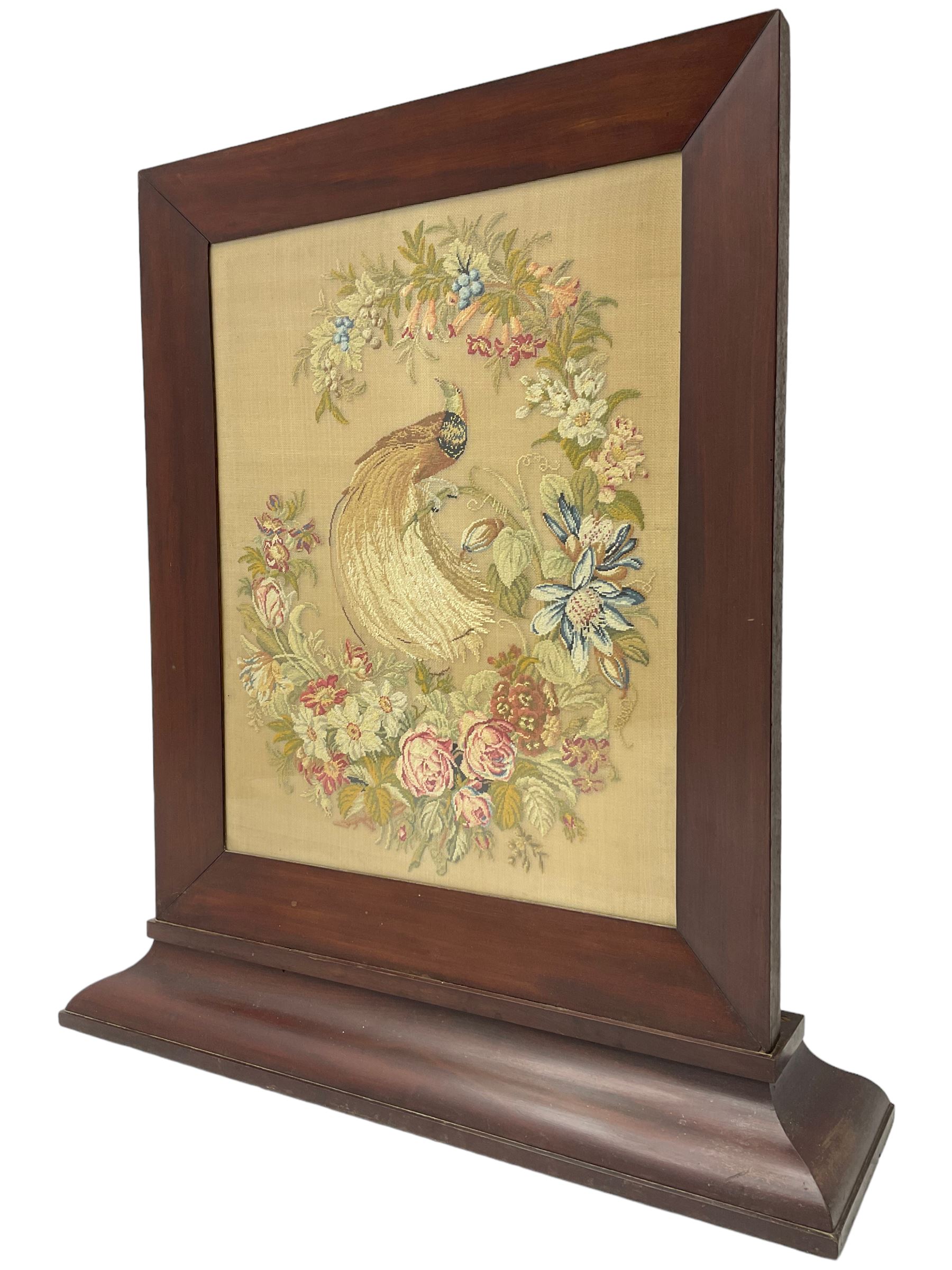Victorian mahogany fire screen, the tapestry panel depicting peacock and flowers