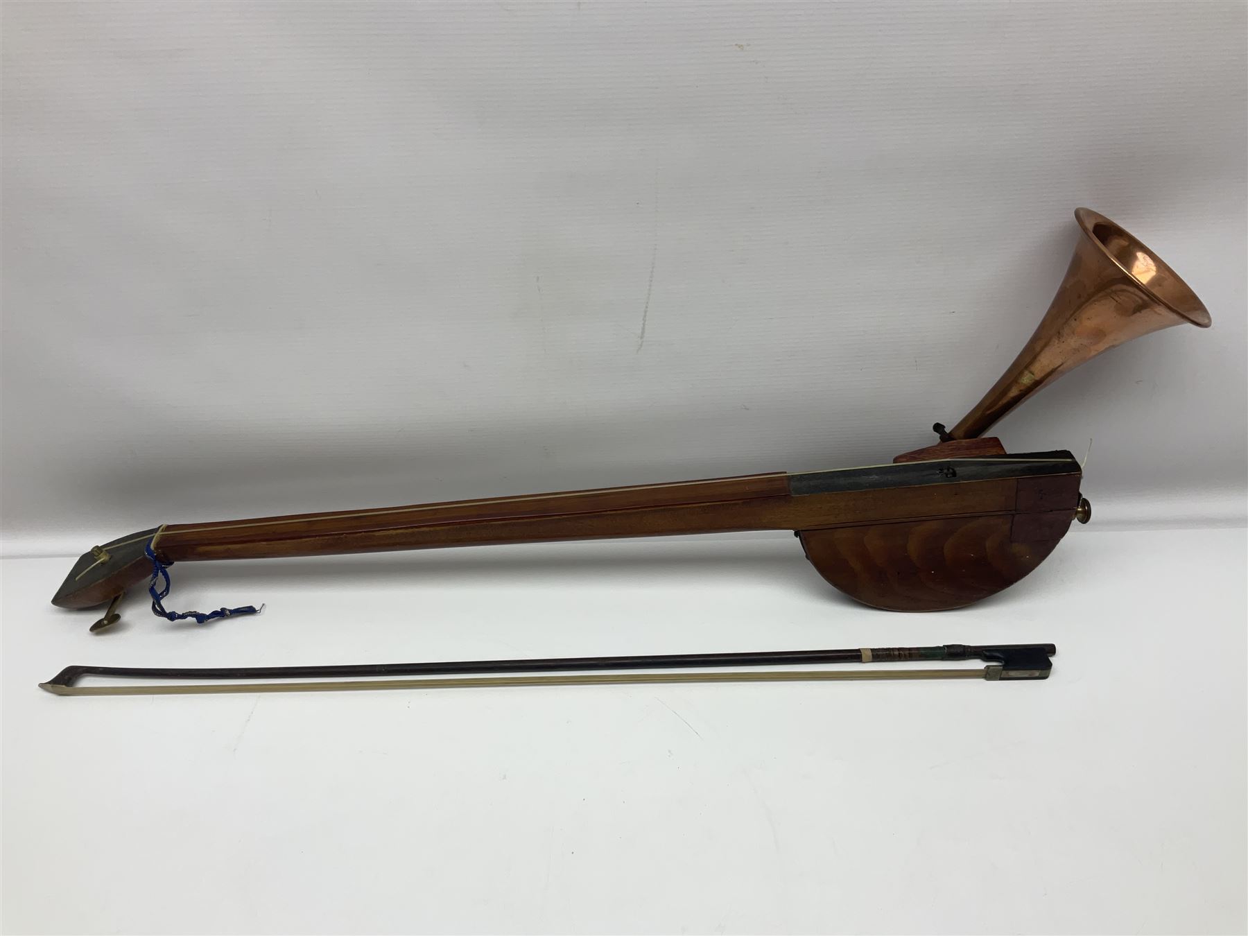 Fruitwood and elm single string phono fiddle with long neck and copper horn L76cm; and a violin bow (2)