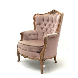 *20th century beech framed French style armchair, the shaped and moulded frame carved with foliate cartouche and flower heads, cabriole supports, W70cm, H98cm