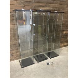 Three Ikea rosewood finish illuminated four glass shop display cabinets, with shelves and keys