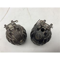 Two inert WW2 Mills Bomb (pineapple) hand grenades; one adapted as a money box with coin slit to the side and later cap H9.5cm (2)