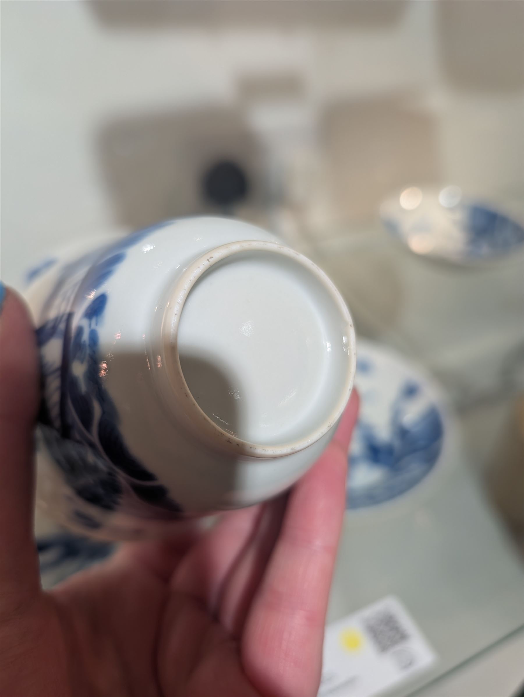 Pair of Chinese blue and white tea bowls, one with cover and four saucers, depicting two figures on a boat at sea, tea bowl H7cm