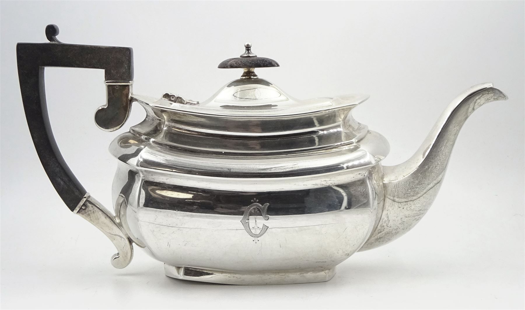 Raich Carter - presentation hallmarked silver two-handled tray of rounded oblong form with gadrooned rim by Wilson & Gill, 139 Regent Street, London, inscribed to the centre 'Presented to Mr. & Mrs. Raich Carter by the Lord Mayor of the City and County of Kingston-upon-Hull Alderman R.E. Smith J.P. on May 30th 1952on behalf of the many Admirers who subscribed to The Lord Mayor's Testimonial Fund in recognition of Raich Carter's genius as a footballer and his services to the City', London 1937 82oz L61cm; together with a hallmarked silver four-piece tea and coffee set by Cooper Bros. & Sons Ltd, the teapot of London shape with ebonised handle and knop, each piece engraved with an initial 'C', Sheffield 1920  60.5oz, teapot L29.5cm