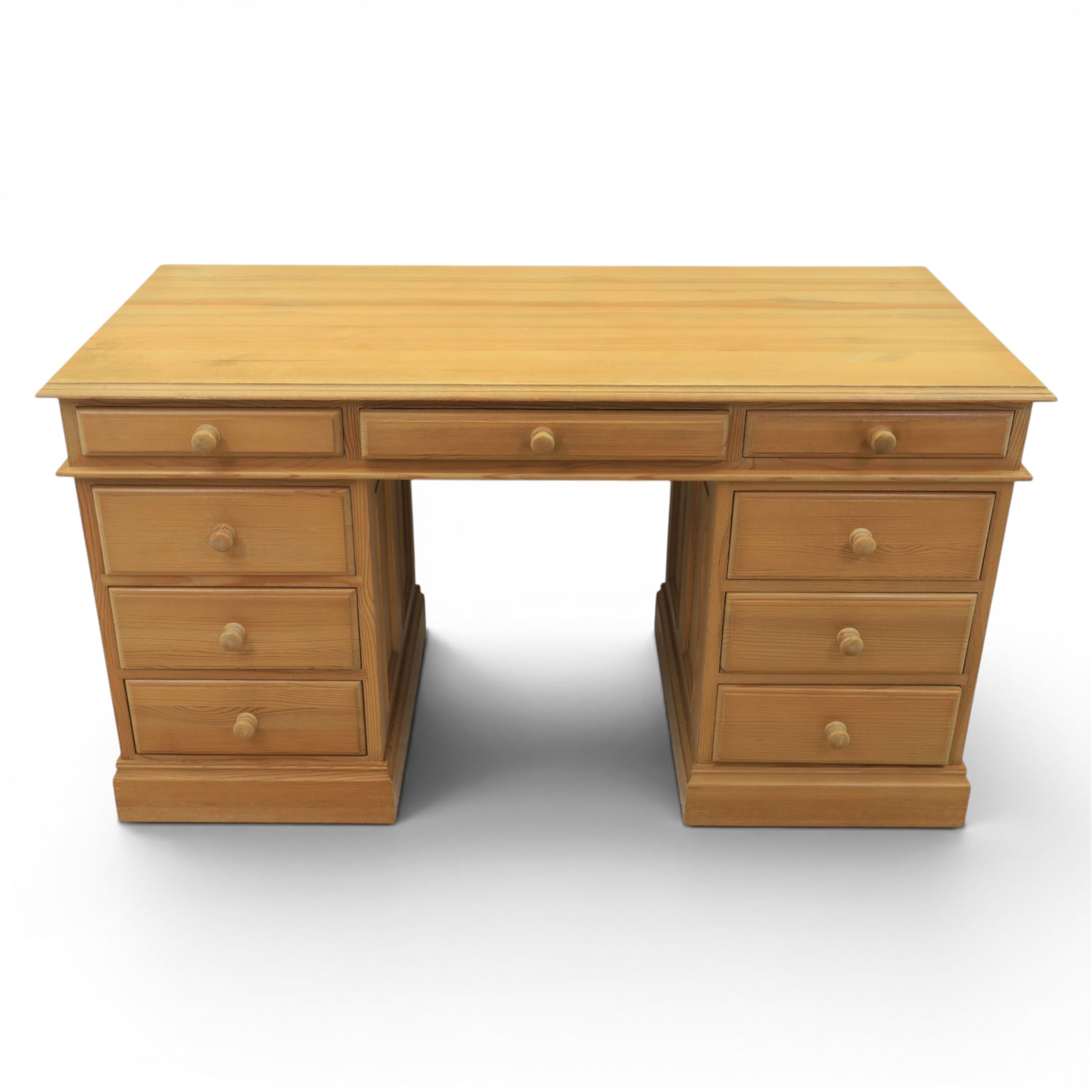 Solid pine twin pedestal desk, fitted with nine drawers, fielded panelled sides