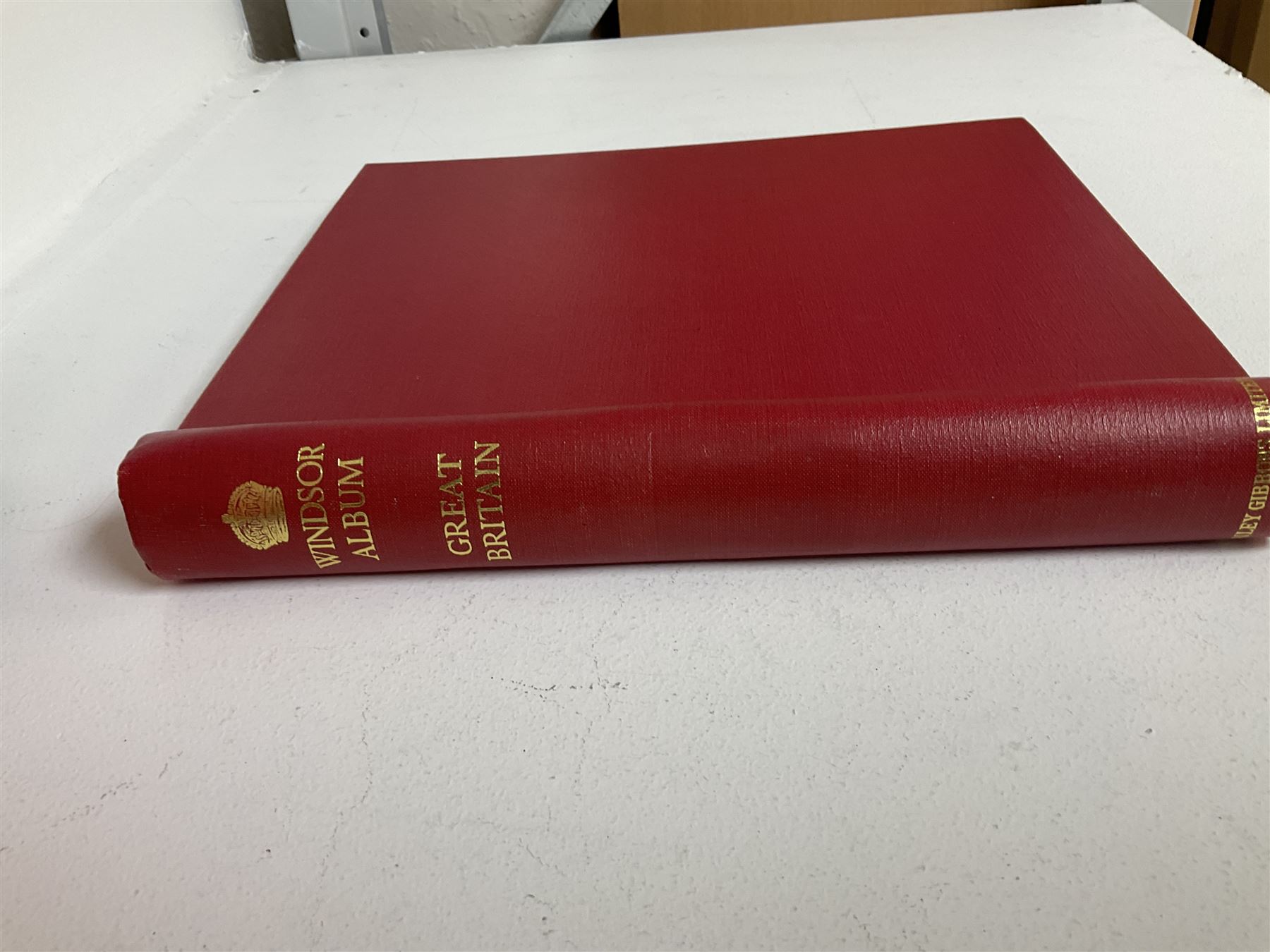 Queen Victoria and later Great British stamps housed in a red 'Windsor' album, including penny reds etc