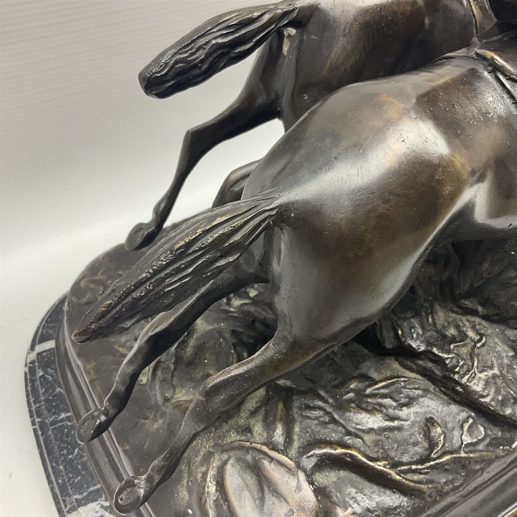 After E Loiscay, bronzed figure group, modelled as two race horses, signed E Loiscay, upon a stepped marble plinth, overall H28cm