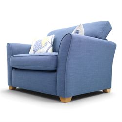 Contemporary blue small sofa bed, shaped arms with loose seat cushions, stowed bed beneath, raised on light wood feet