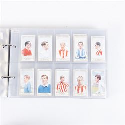 Collection of Edwardian and later Football related trading and cigarette cards, including forty-nine of fifty 1906 Ogden's Football Club Colours, 1922 PALS Footall series, ninety of one hundred 1925 Gallaher Famous Footballers, complete set of forty-four 1926 Ogden's Captains of Association Football Clubs and Colours, complete set of fifty 1927 Players Football Caricatures by MAC,  complete set of fifty 1927 Players Football Caricatures by RIP,  complete set of fifty 1930 Players Association Cup Winners, complete set of 50 1933 Ogdens AFC Nicknames etc, housed in brown cigarette card album