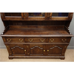  Traditional oak dresser, projecting cornice, three stepped arched glazed doors enclosing three shelves, above three drawers and panelled cupboard doors, bracket feet, W169cm, H203cm, D46cm  