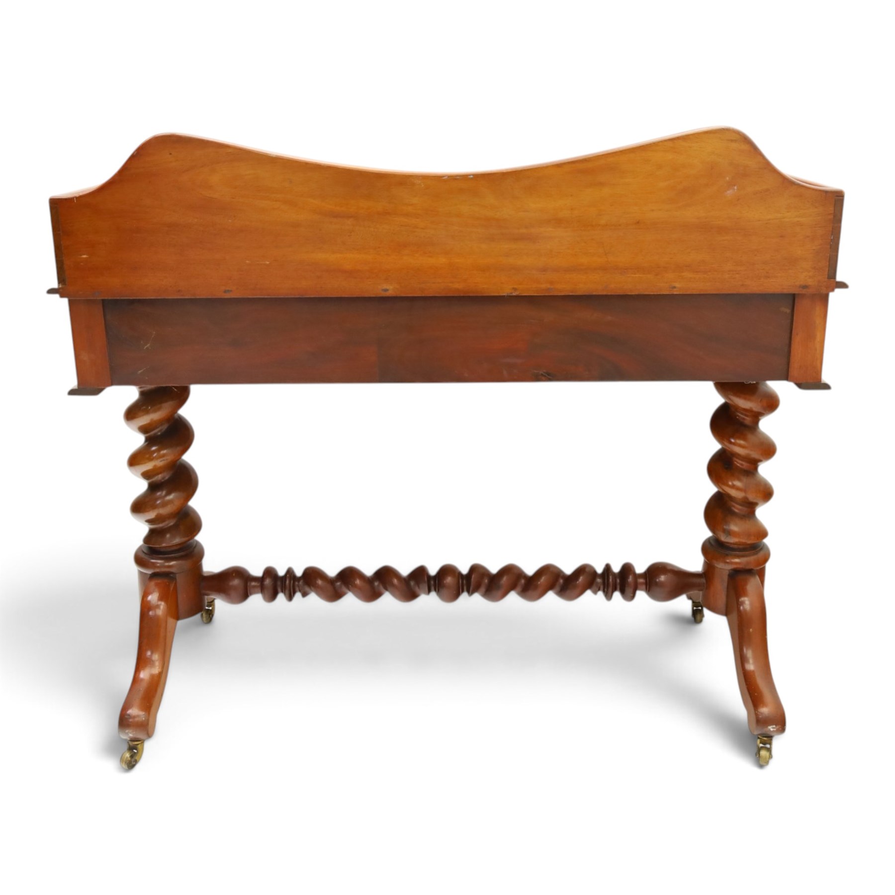 Victorian mahogany washstand with raised three-quarter back, fitted with two frieze drawers with glass handles, raised on spiral turned supports with splayed supports and castors united by barley-twist stretcher