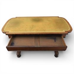 William IV mahogany library table, rectangular top with rounded edges inset with gilt and blind tooled leather writing surface, fitted with opposing frieze drawers, raised upon shaped trestle end supports united by a central upper stretcher, terminating in stylised bun feet with applied roundel bosses