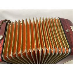 German Hohner student II compact accordion with 26 keys and 12 bass registers in a hard case With tutor