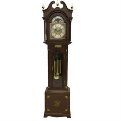 A  20th century longcase clock made to celebrate the millennium in the year 2000, this clock being No 2 of only 200 manufactured by  Richard Broad in Bodmin Cornwall, with a mahogany effect case and traditional swans neck pediment with three brass finials, break arch hood door on a trunk with recessed columns and full length glazed door, on a square plinth with inlay and a shaped base, brass dial with brass spandrels, silvered chapter ring, seconds dial and working moon phase to the arch, weight driven three train movement striking the quarters and hours on 12 gong rods, with a choice of St Michael, Westminster and Wittington chimes, with chime selector and chime/silent facility. With three brass cased weights and gridiron pendulum.





