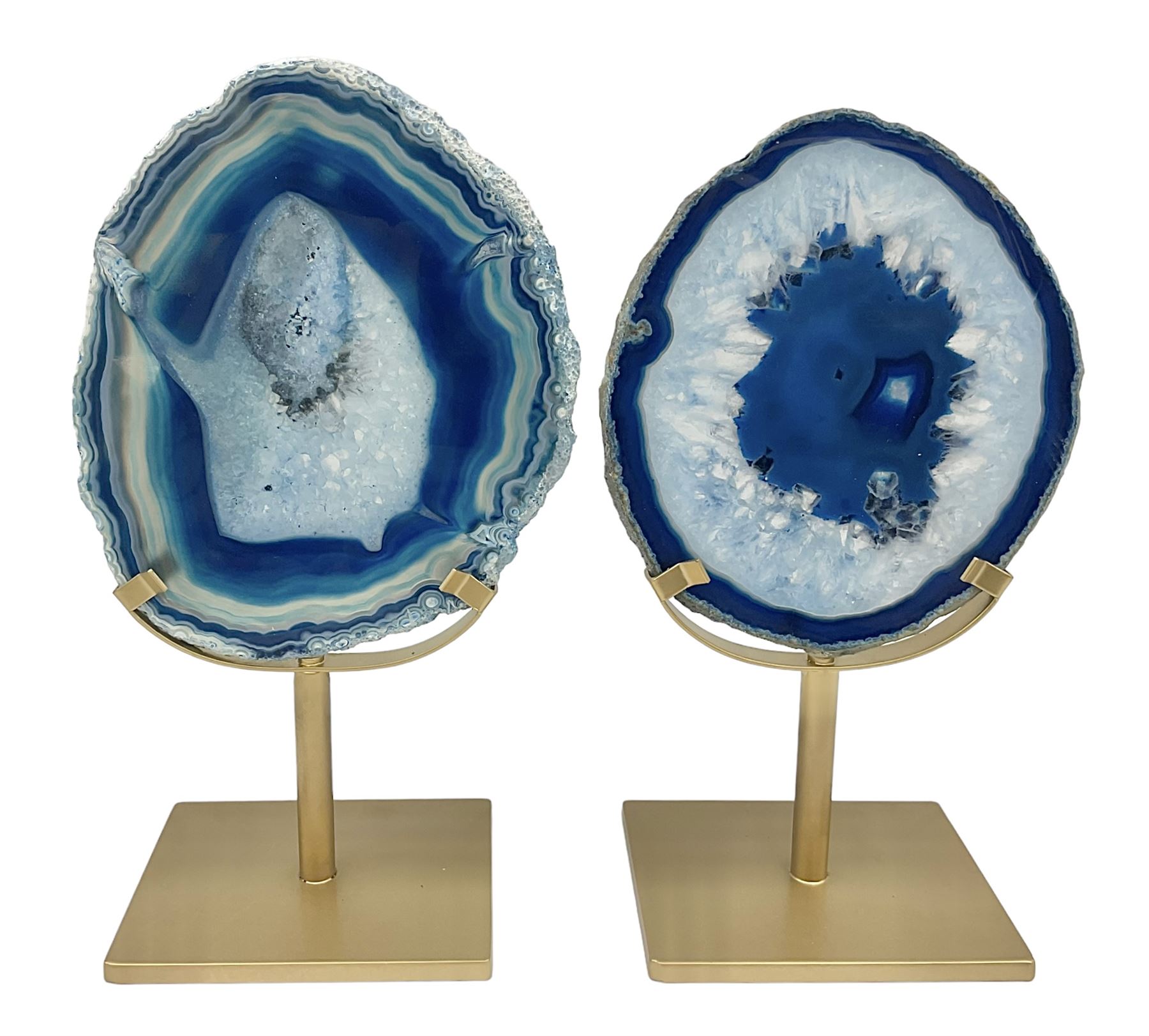 Pair of blue agate slices, polished with rough edges raised upon gilt metal stands, H22cm