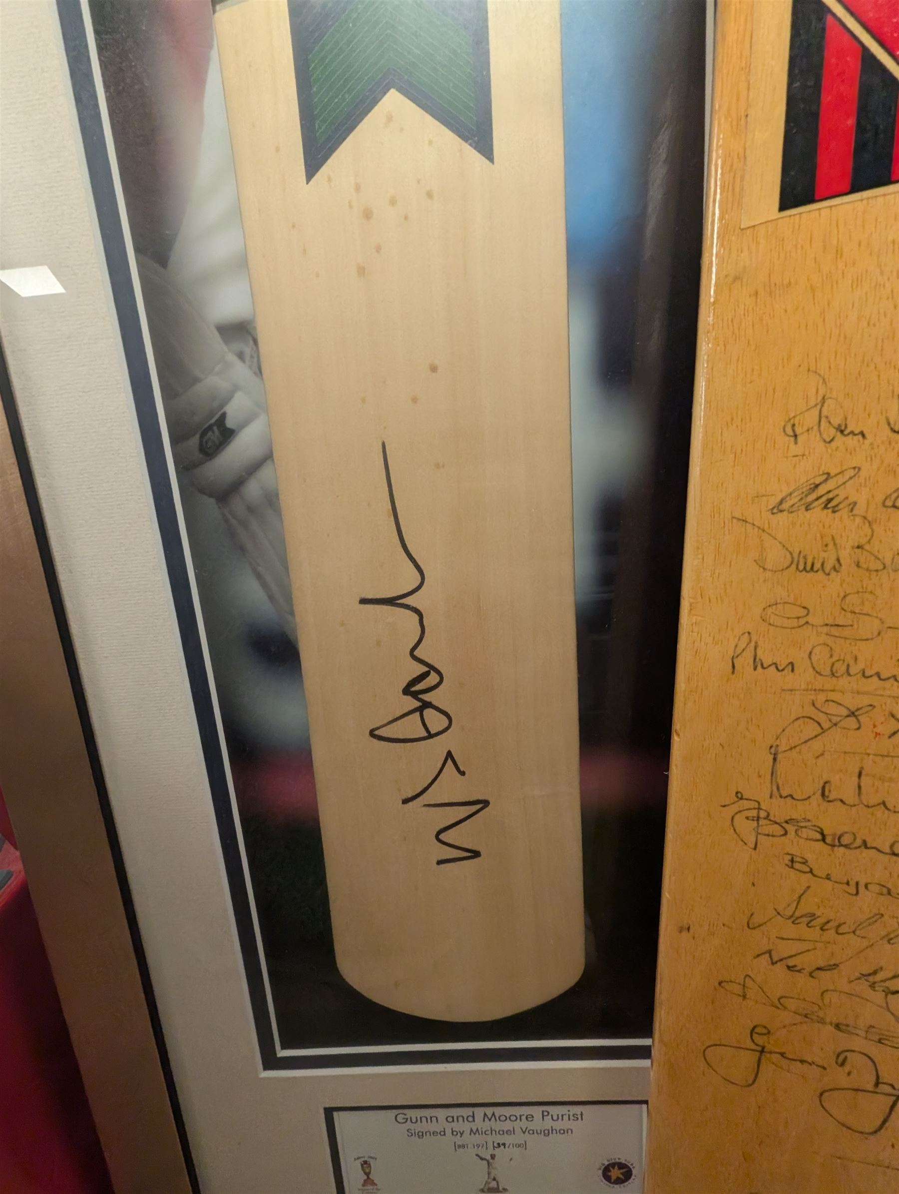 Signed England and Yorkshire cricket memorabilia, including framed bat signed by Michael Vaughn, signed photograph of England team, signed Yorkshire shirt and a signed bat