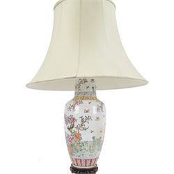 Chinese famille rose table lamp, of baluster form, decorated with birds in blossoming branches, upon a circular wooden base with shade, H78cm