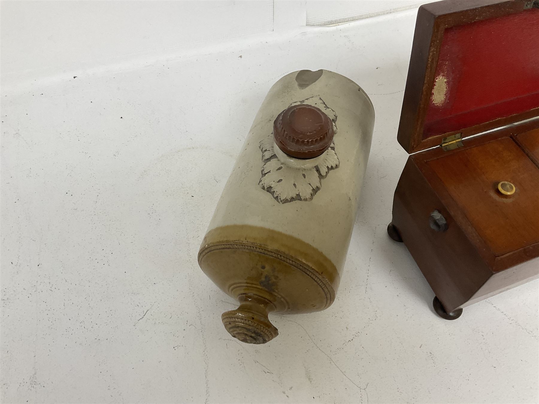 sarcophagus shaped tea caddy with bun feet, together with two stone hot water bottles, caddy H17cm 